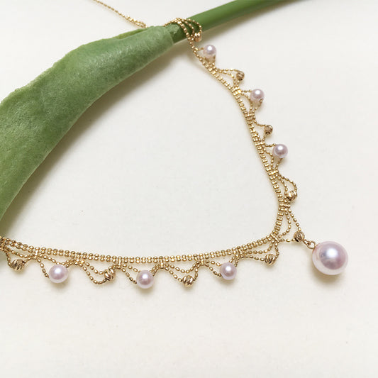 Elegant 18K Gold Draped Sea Pearl Necklace