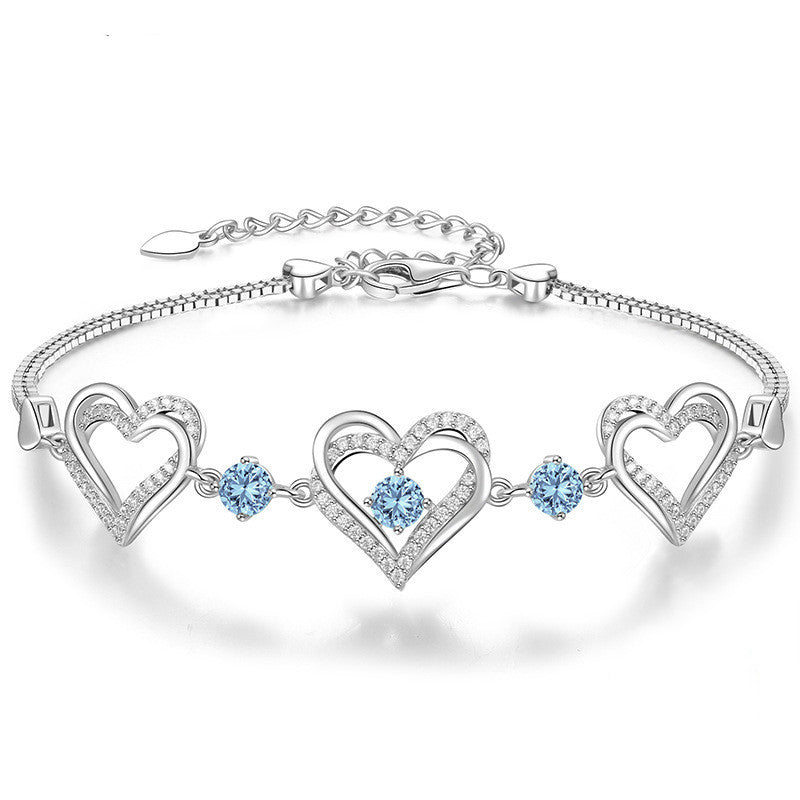 Romantic Heart Bracelet with Red Gemstones & Diamond Accents in Sterling Silver