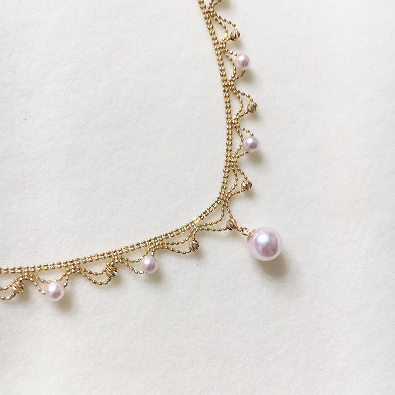 Elegant 18K Gold Draped Sea Pearl Necklace