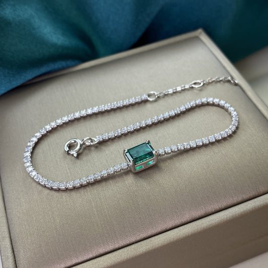 Regal Radiance: Sterling Silver Emerald-Cut Tennis Bracelet