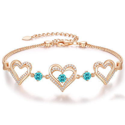 Romantic Heart Bracelet with Red Gemstones & Diamond Accents in Sterling Silver