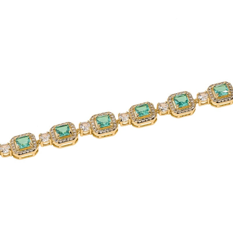 Golden Glow Emerald Square Tennis Bracelet