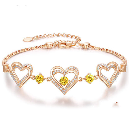 Romantic Heart Bracelet with Red Gemstones & Diamond Accents in Sterling Silver