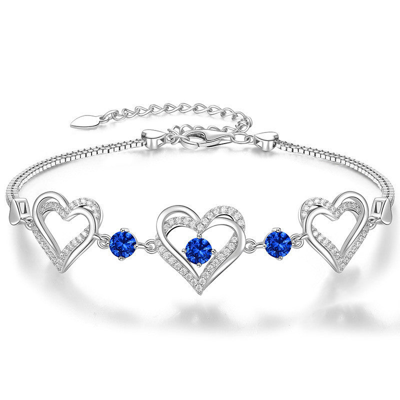 Romantic Heart Bracelet with Red Gemstones & Diamond Accents in Sterling Silver