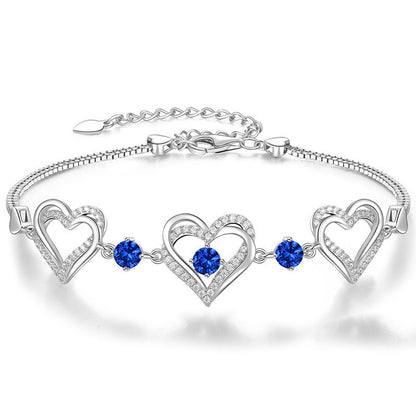 Romantic Heart Bracelet with Red Gemstones & Diamond Accents in Sterling Silver