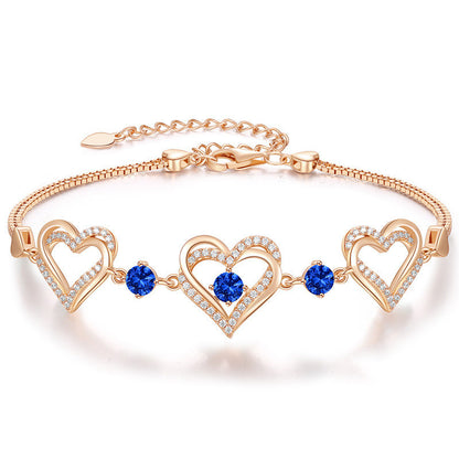 Romantic Heart Bracelet with Red Gemstones & Diamond Accents in Sterling Silver