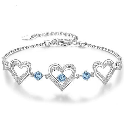 Romantic Heart Bracelet with Red Gemstones & Diamond Accents in Sterling Silver