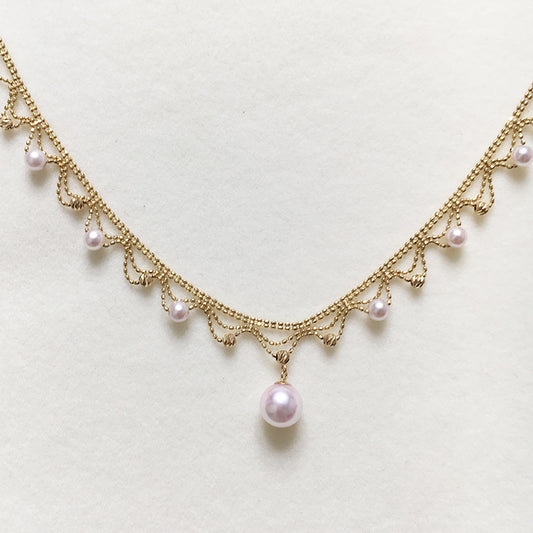 Elegant 18K Gold Draped Sea Pearl Necklace